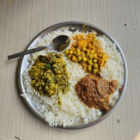 A dham served on a leaf plate